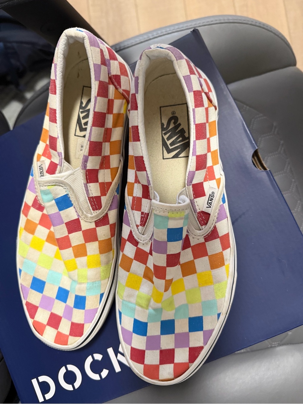 Vans women’s Rainbow Checkerboard Slip-On Sneakers